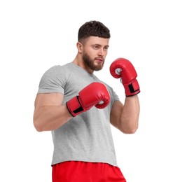 Photo of Man in boxing gloves fighting on white background