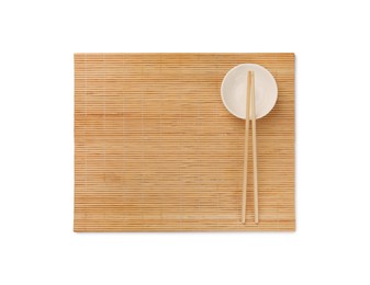 Photo of Bamboo mat, bowl and chopsticks isolated on white, top view