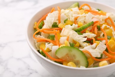 Photo of Tasty salad with Chinese cabbage, carrot, corn and cucumber in bowl on white marble table, closeup