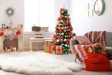 Room interior with Christmas tree and Santa's bag of gifts