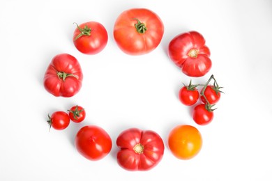 Photo of Frame of different ripe tomatoes on white background, flat lay. Space for text