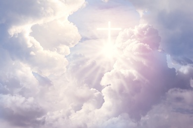 Image of Cross silhouette in sky with clouds. Resurrection of Jesus