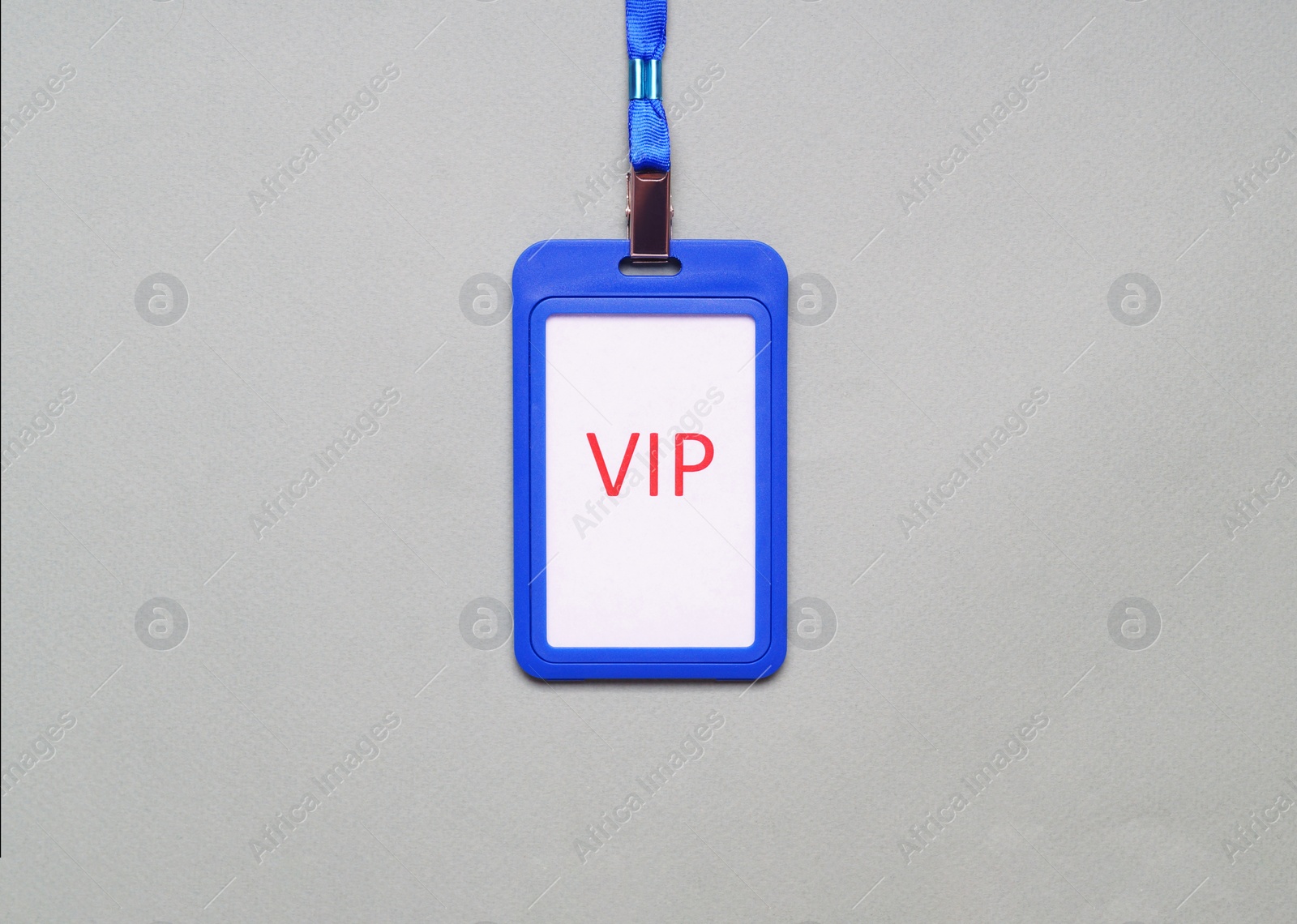 Photo of Plastic vip badge on light gray background, top view