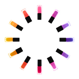 Set of different nail polishes on white background, top view