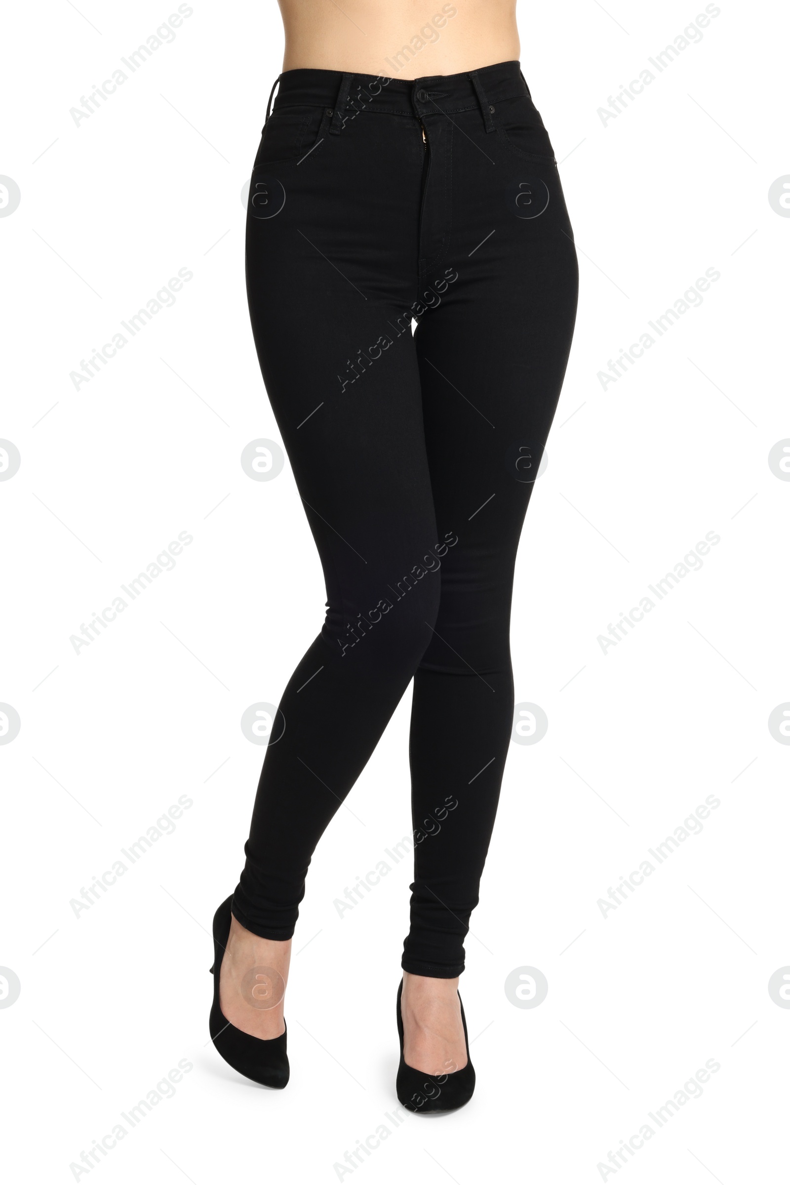 Photo of Woman wearing stylish black jeans and high heels shoes on white background, closeup