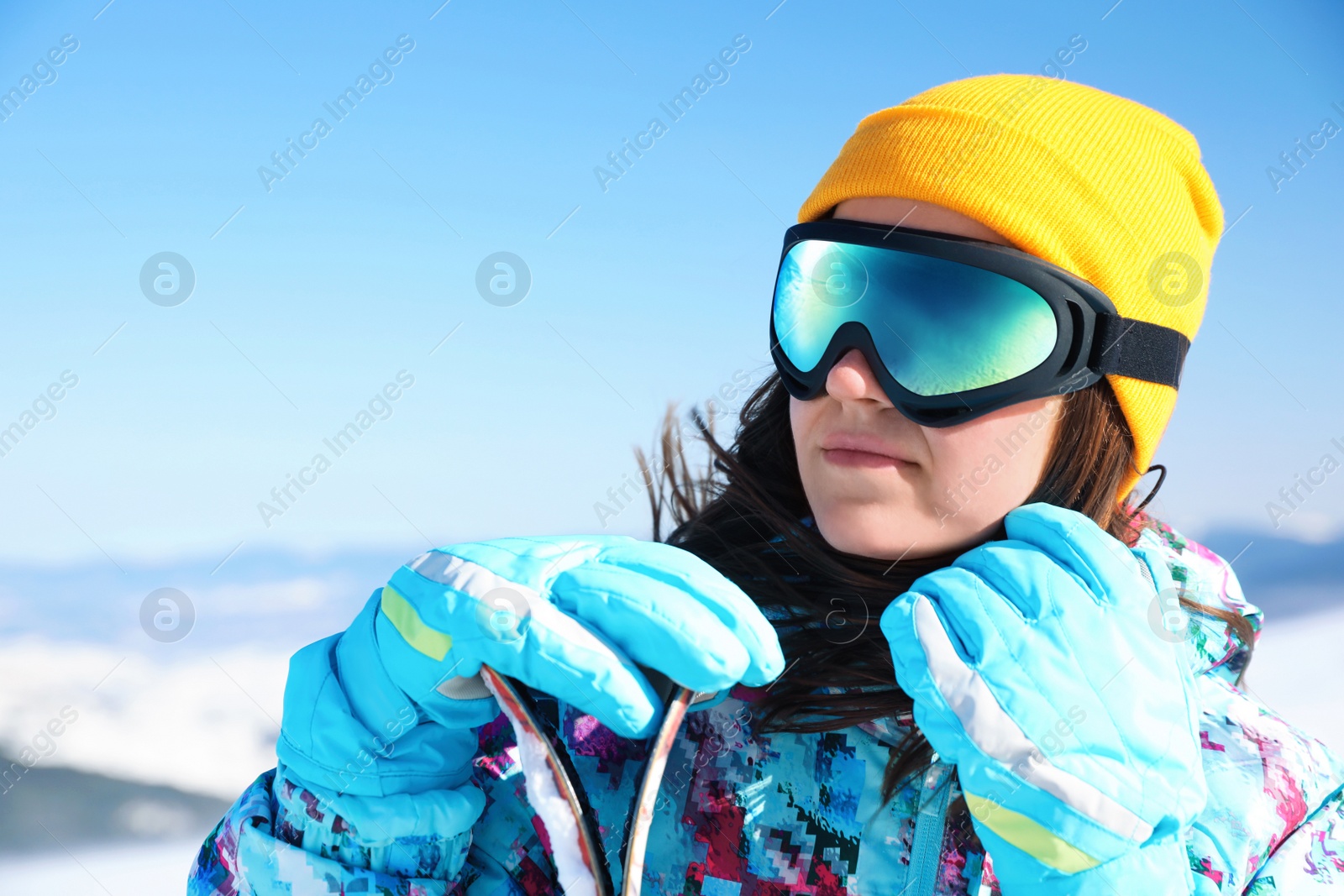 Photo of Young woman at ski resort. Winter vacation