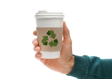 Man holding paper coffee cup with recycling symbol on white background, closeup