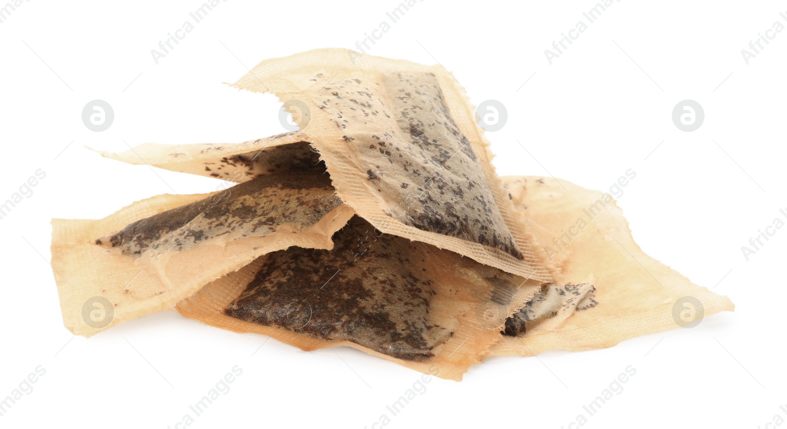 Photo of Many used tea bags on white background