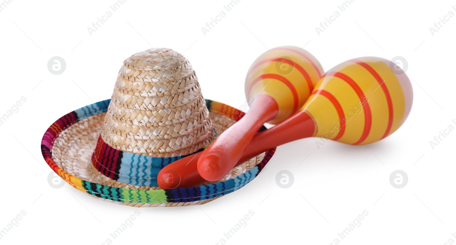 Photo of Colorful maracas and sombrero hat isolated on white. Musical instrument