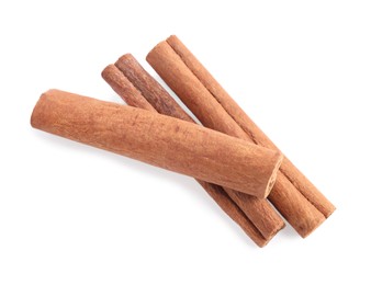 Photo of Aromatic cinnamon sticks isolated on white, top view