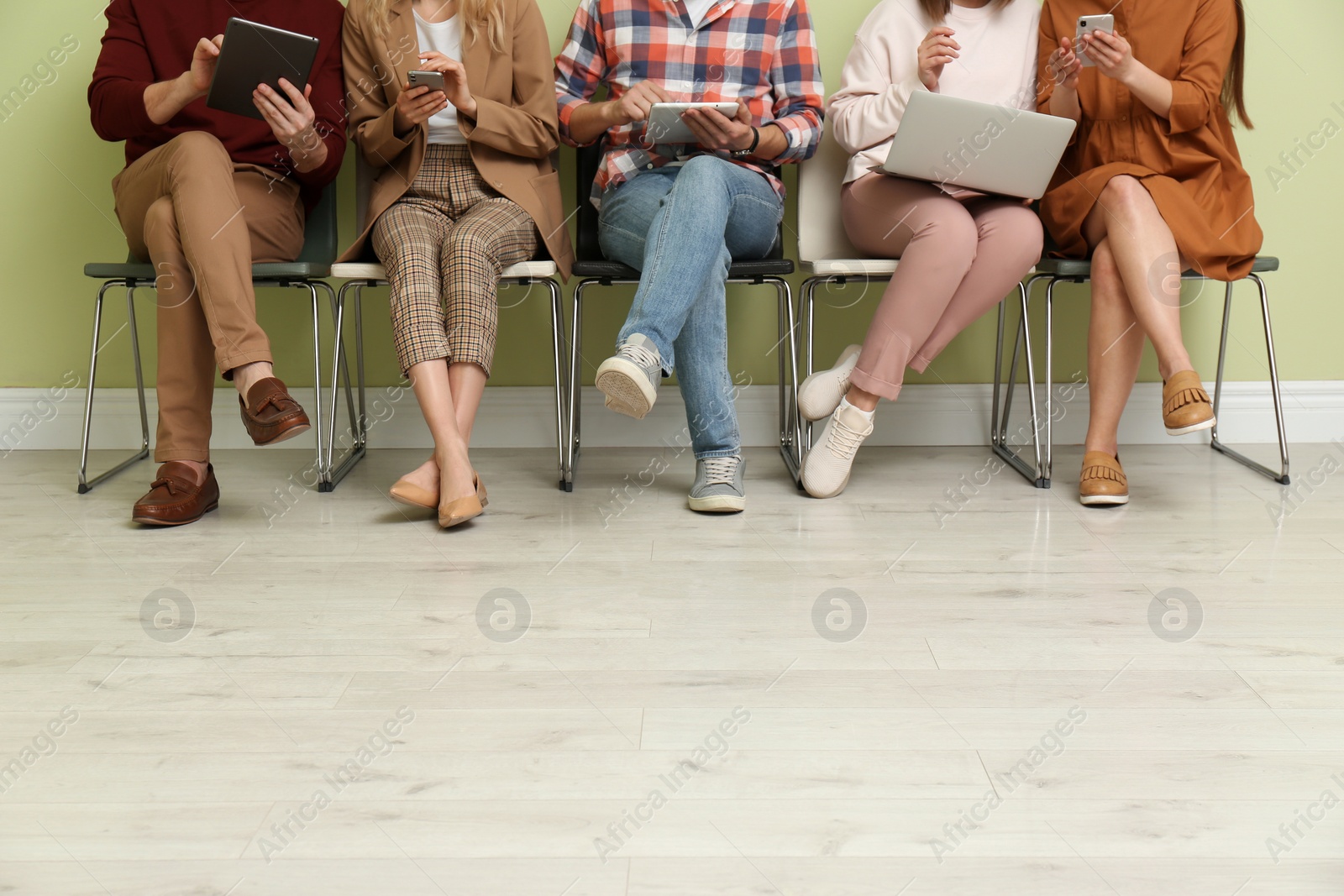 Photo of People waiting for job interview indoors, closeup