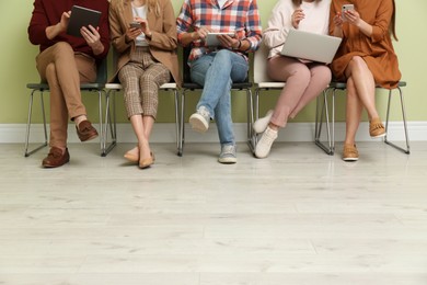 People waiting for job interview indoors, closeup