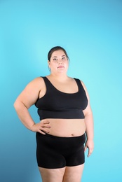 Photo of Overweight woman before weight loss on color background