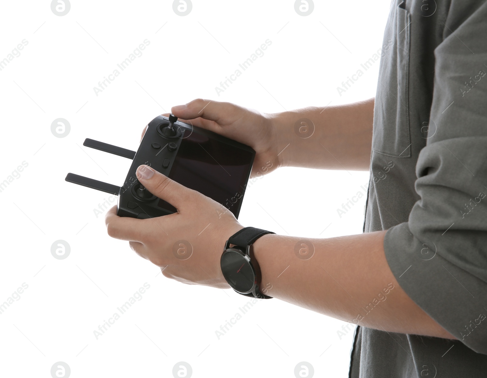 Photo of Man holding new modern drone controller on white background, closeup of hands