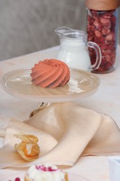 Beautiful composition of delicious desserts on beige table indoors. Food stylist