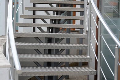Photo of View of beautiful metal stairs with railings outdoors