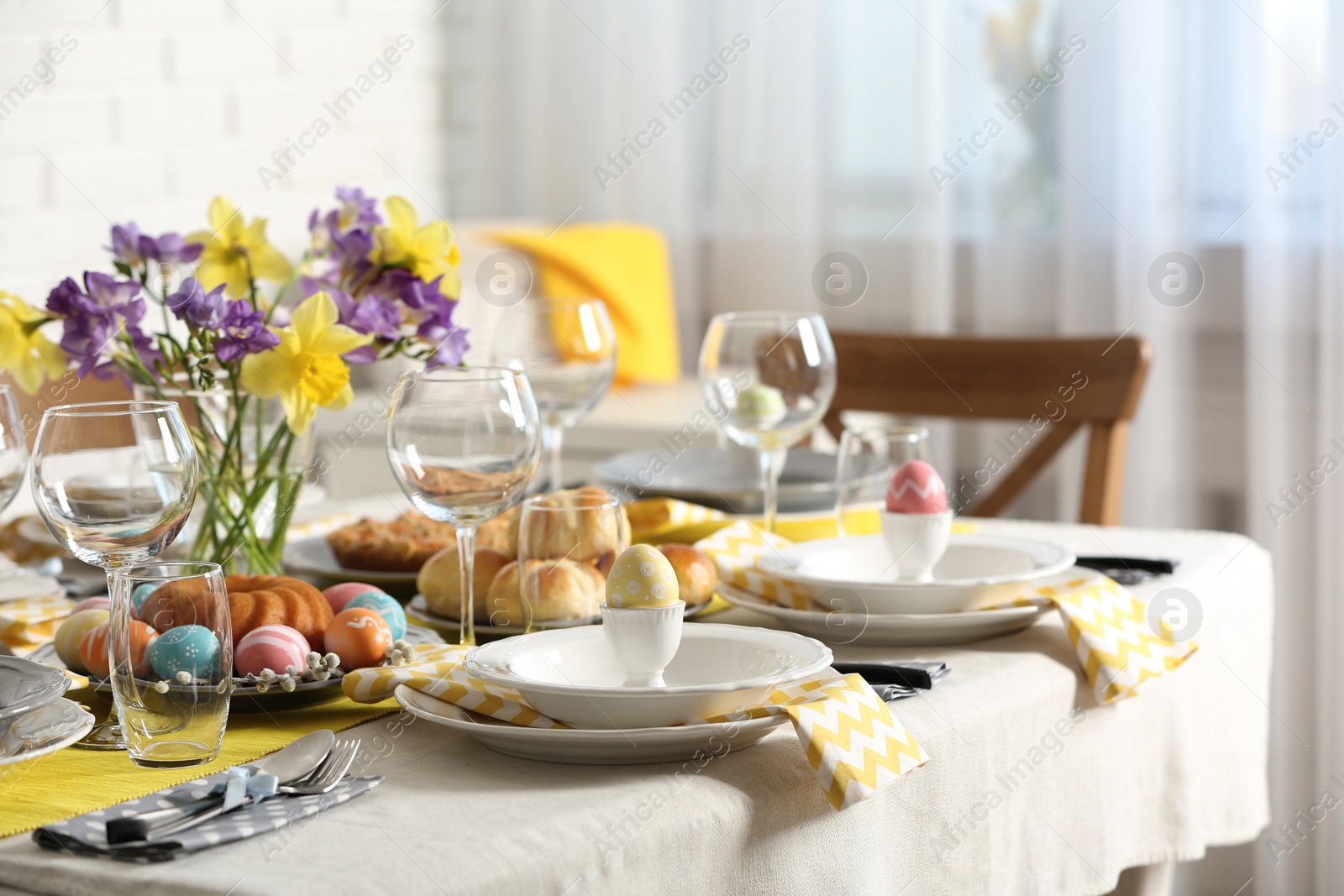 Photo of Festive Easter table setting with traditional meal at home, space for text