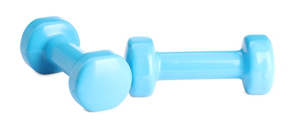 Photo of Light blue dumbbells isolated on white. Sports equipment