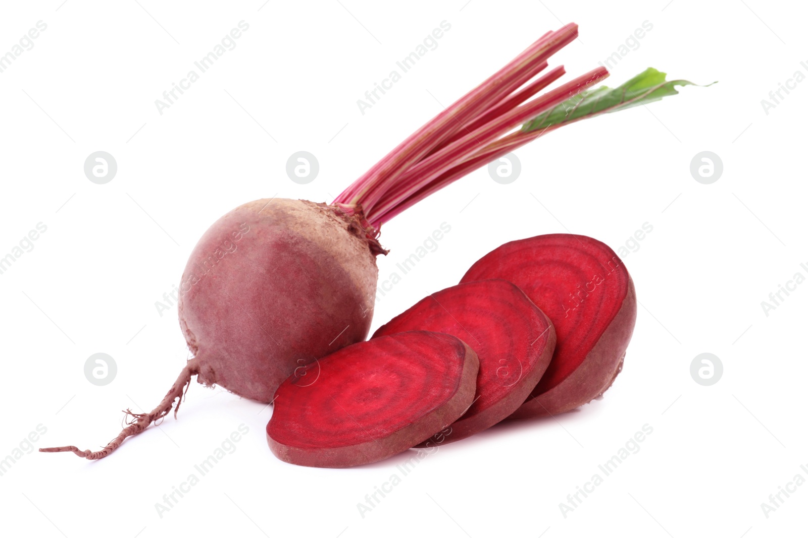 Photo of Whole and cut red beets on white background