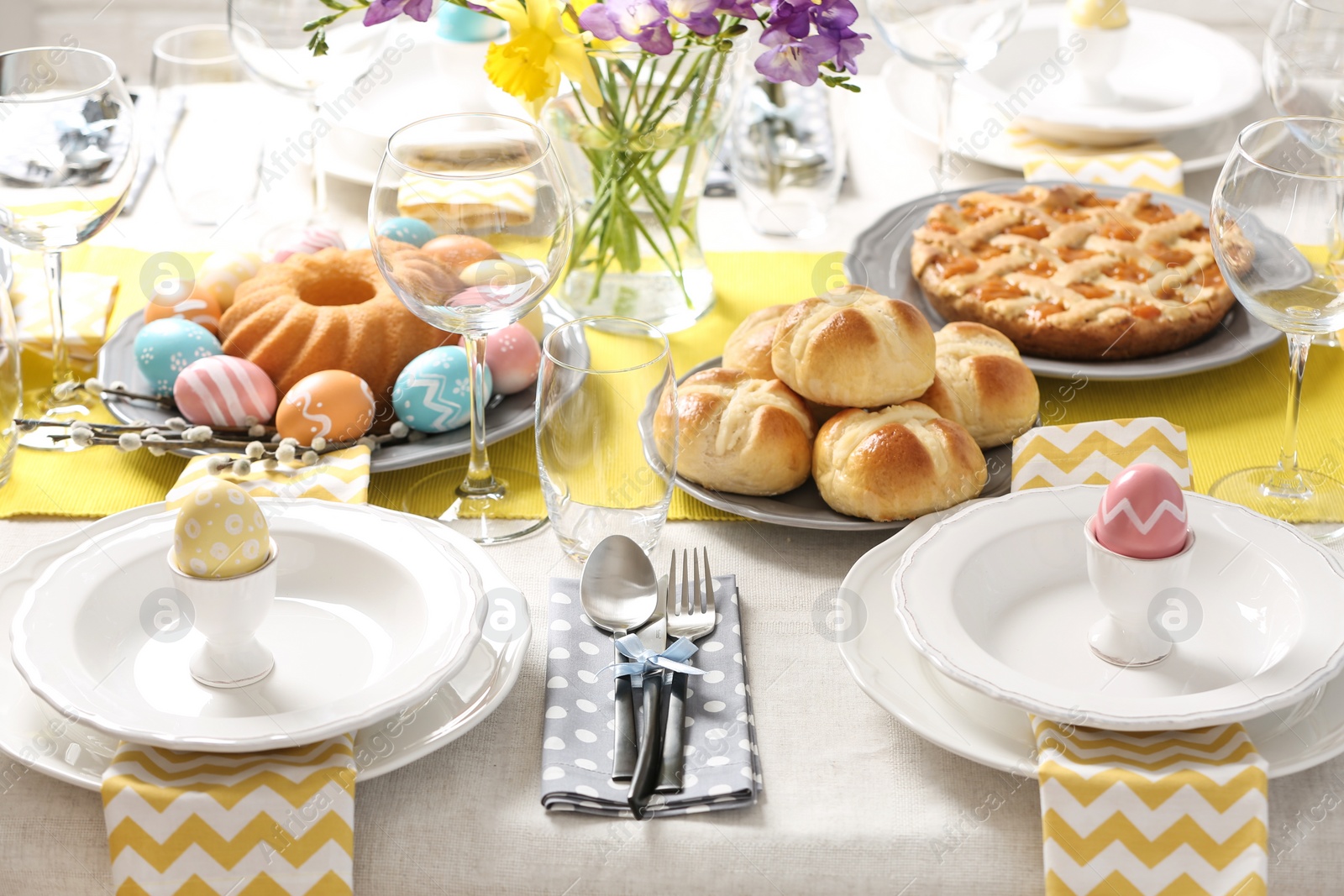 Photo of Festive Easter table setting with traditional meal