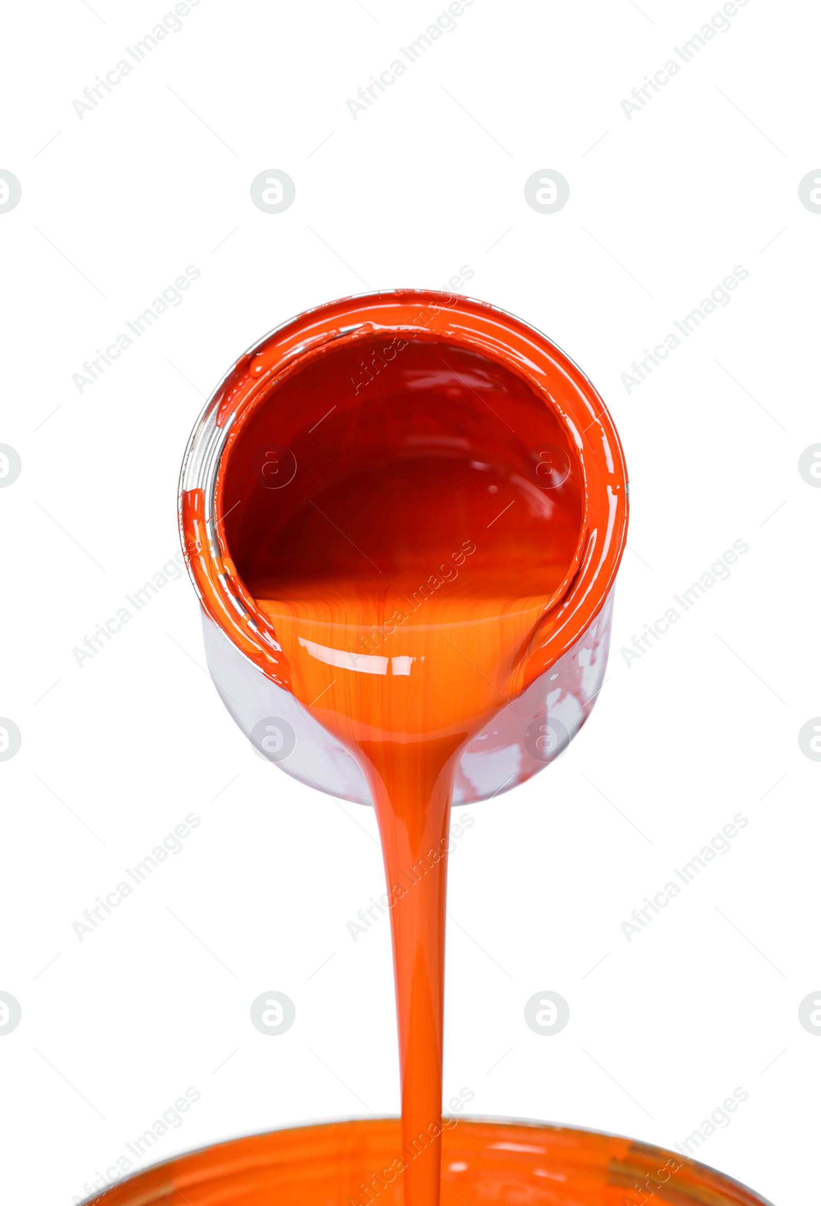 Photo of Pouring orange paint from can on white background