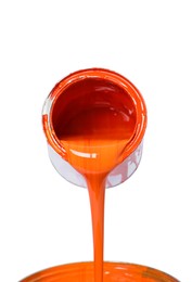 Photo of Pouring orange paint from can on white background