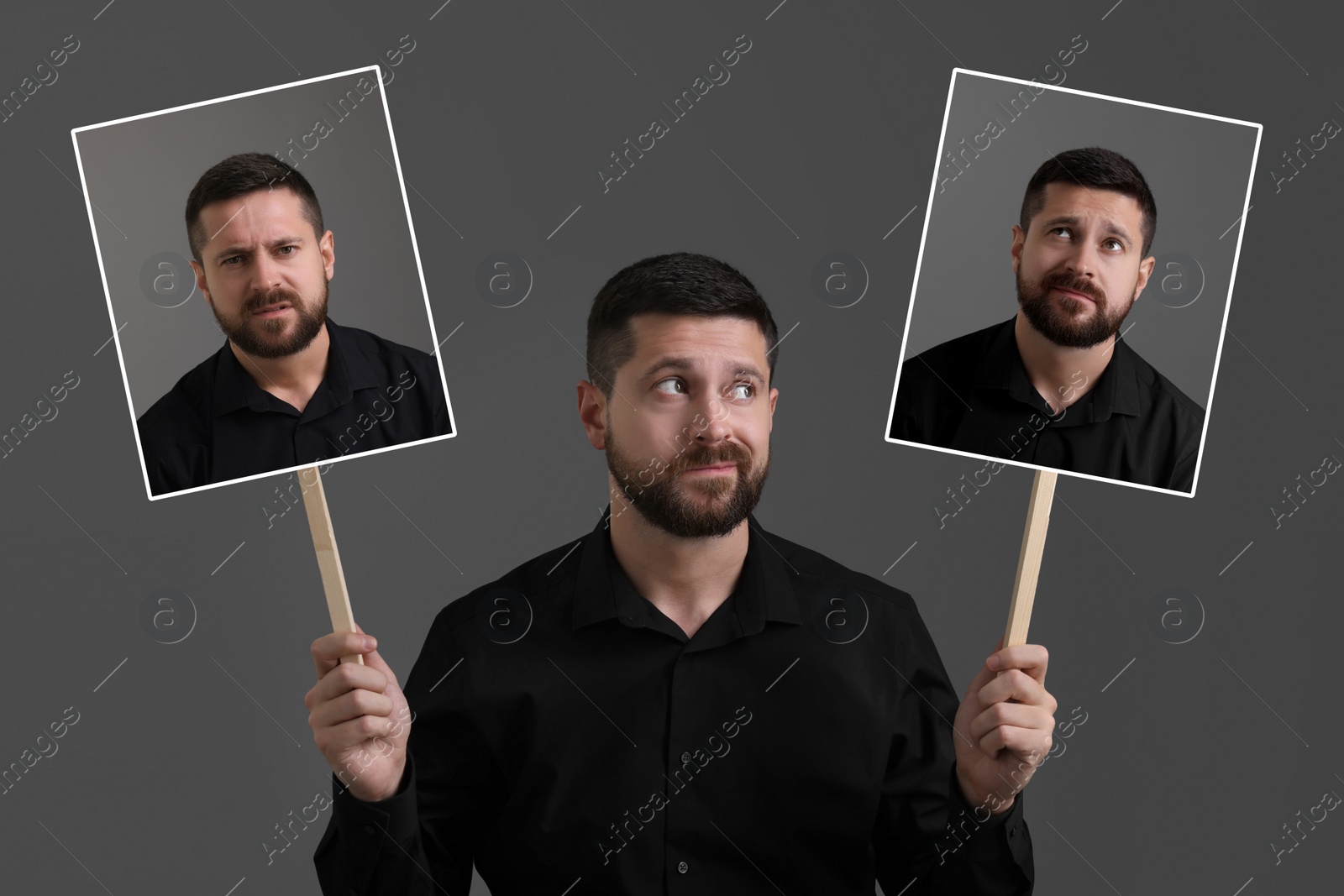 Image of Man holding his photo portraits showing different emotions on grey background. Balanced personality