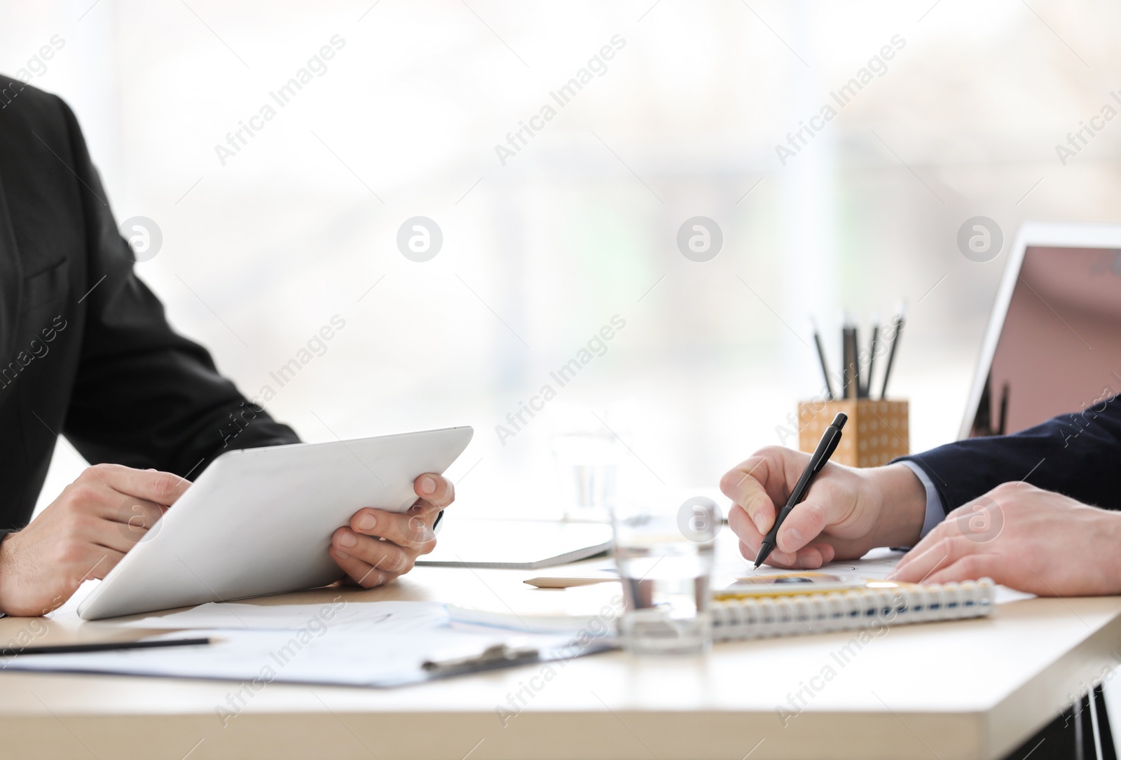 Photo of Business trainer and client working in office, closeup