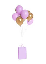 Image of Bunch of color balloons and lilac paper bag on white background