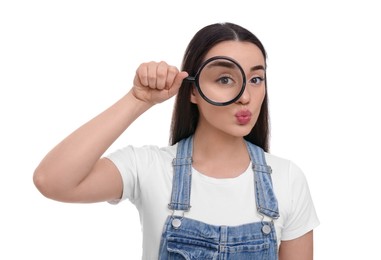 Photo of Curious young woman looking through magnifier glass on white background