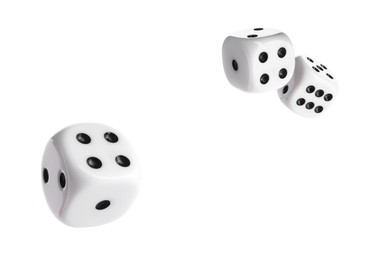 Three dice in air on white background