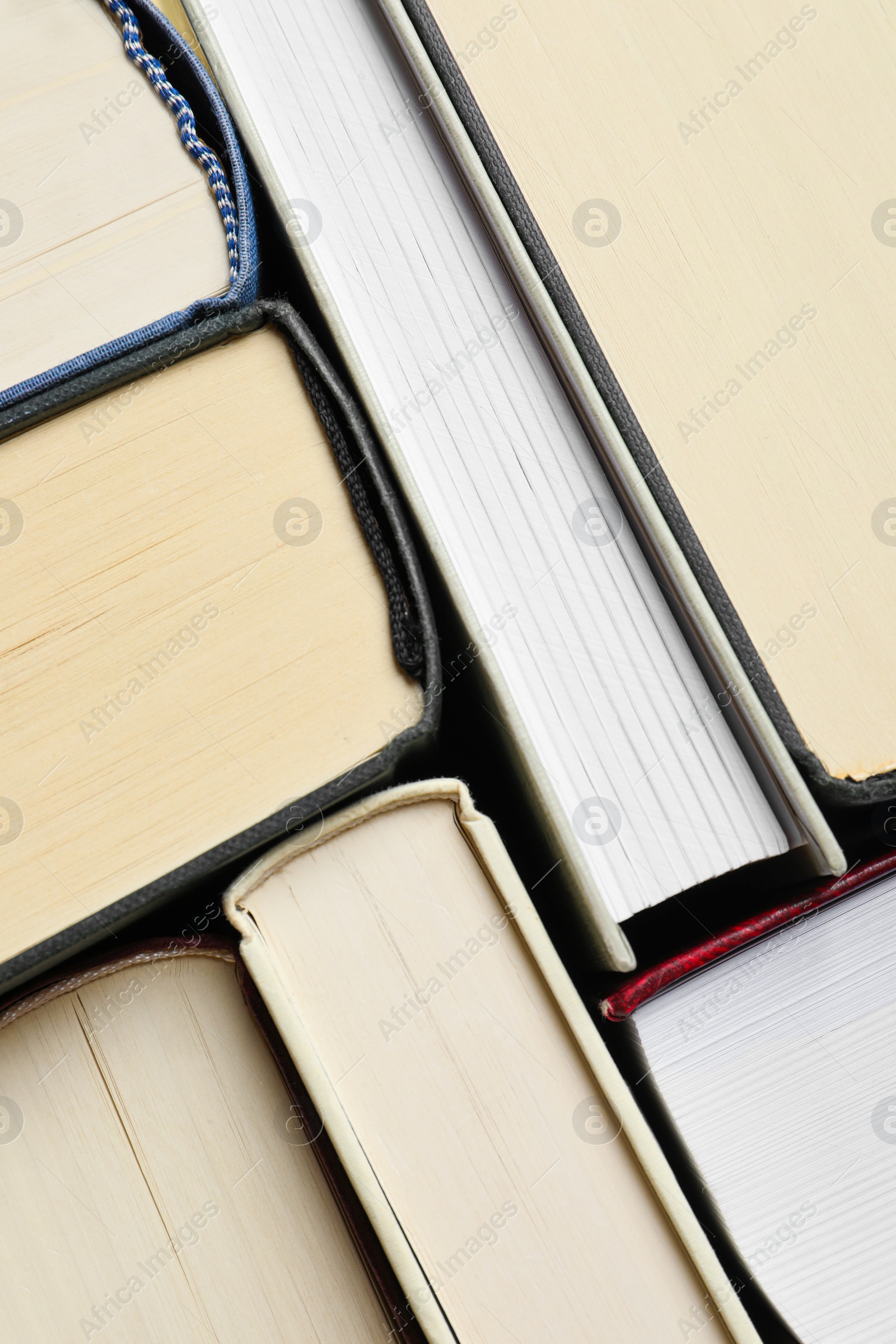 Photo of Many hardcover books as background, top view