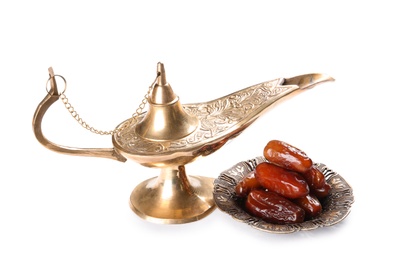 Photo of Aladdin lamp and dates, isolated on white