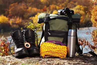 Photo of Set of camping equipment on ground outdoors