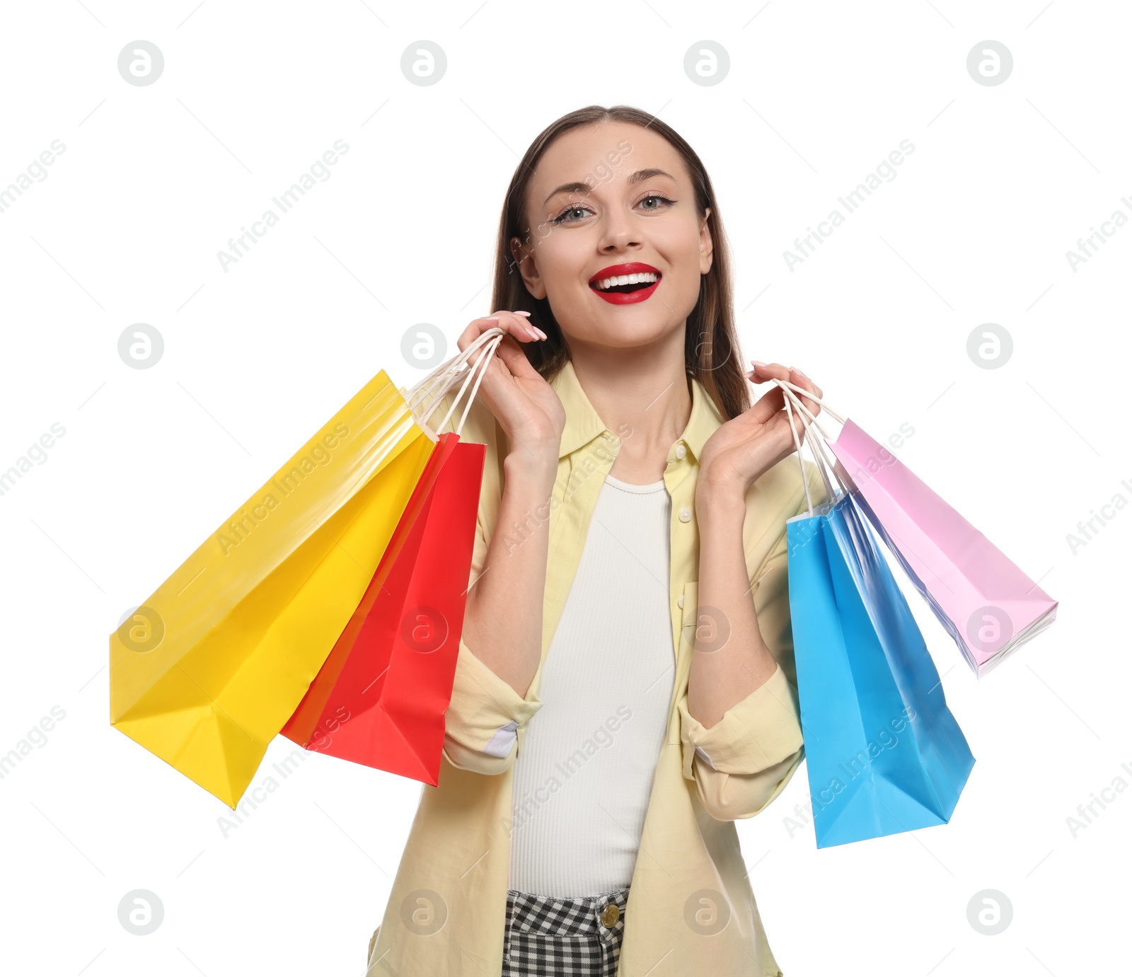 Photo of Stylish young woman with shopping bags on white background