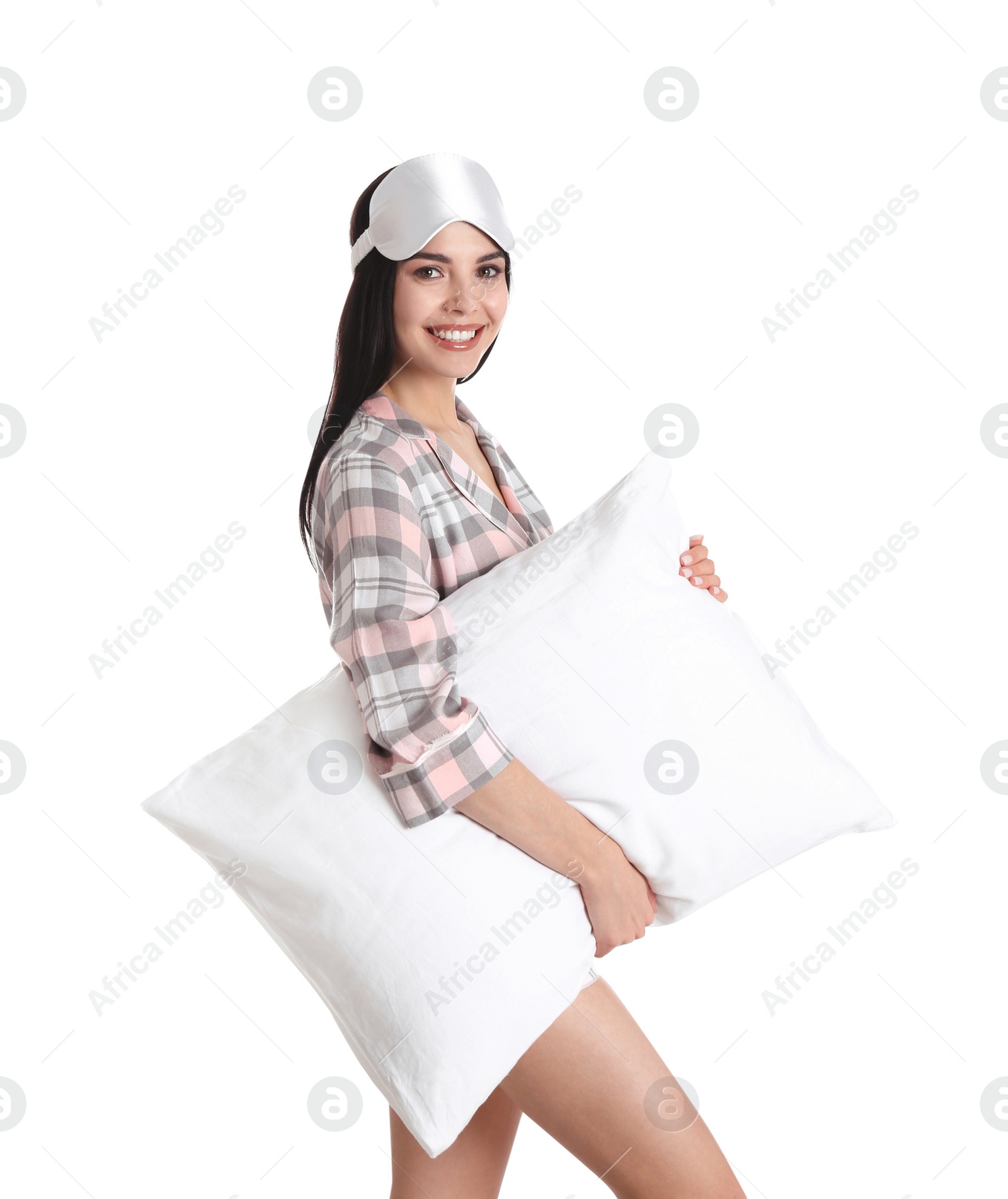 Photo of Young woman with pillow and sleep mask on white background