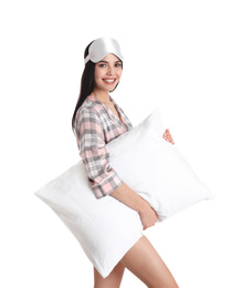 Photo of Young woman with pillow and sleep mask on white background