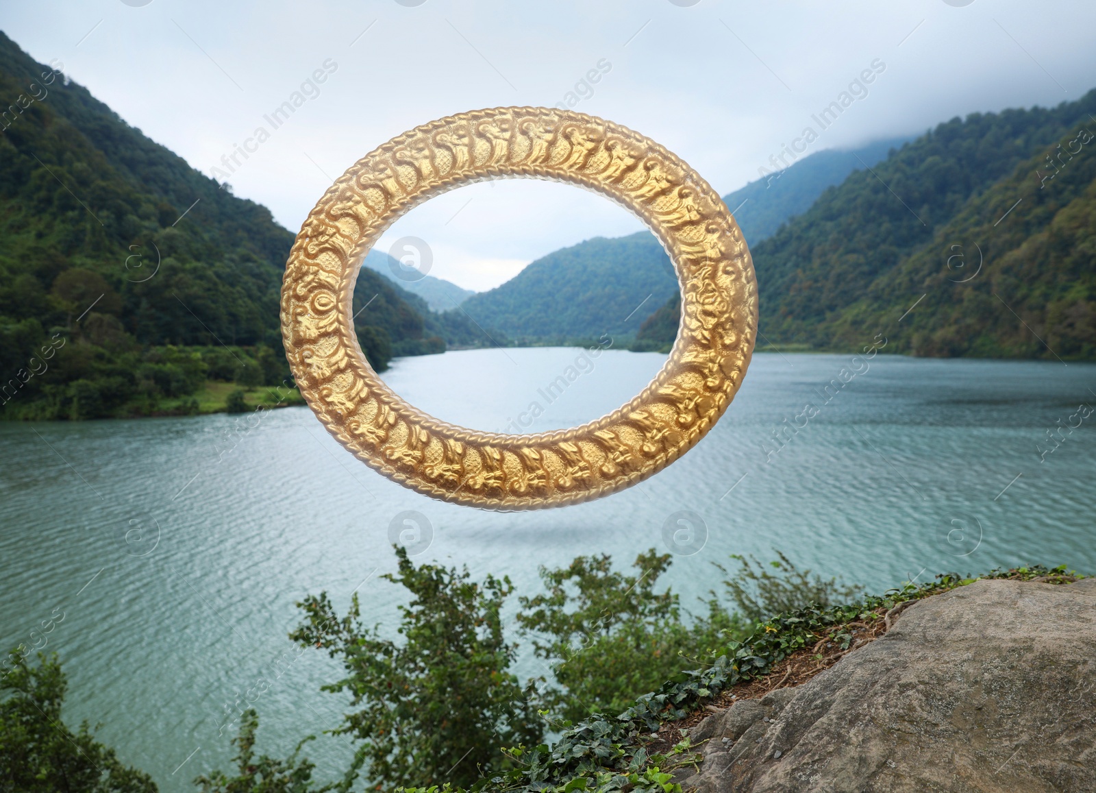 Image of Vintage frame and lake between mountains under cloudy sky