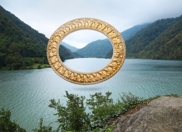 Vintage frame and lake between mountains under cloudy sky