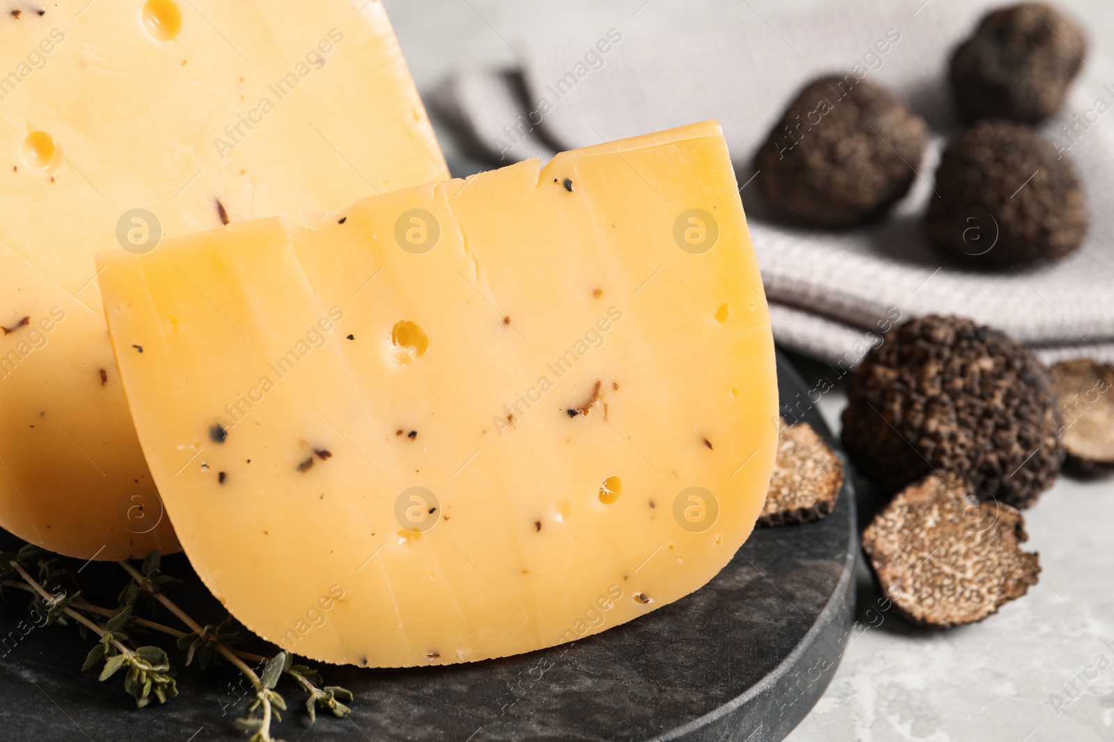 Photo of Fresh cheese and truffles on table, closeup