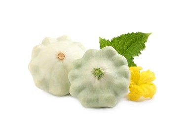 Fresh ripe pattypan squashes with leaf and flower on white background