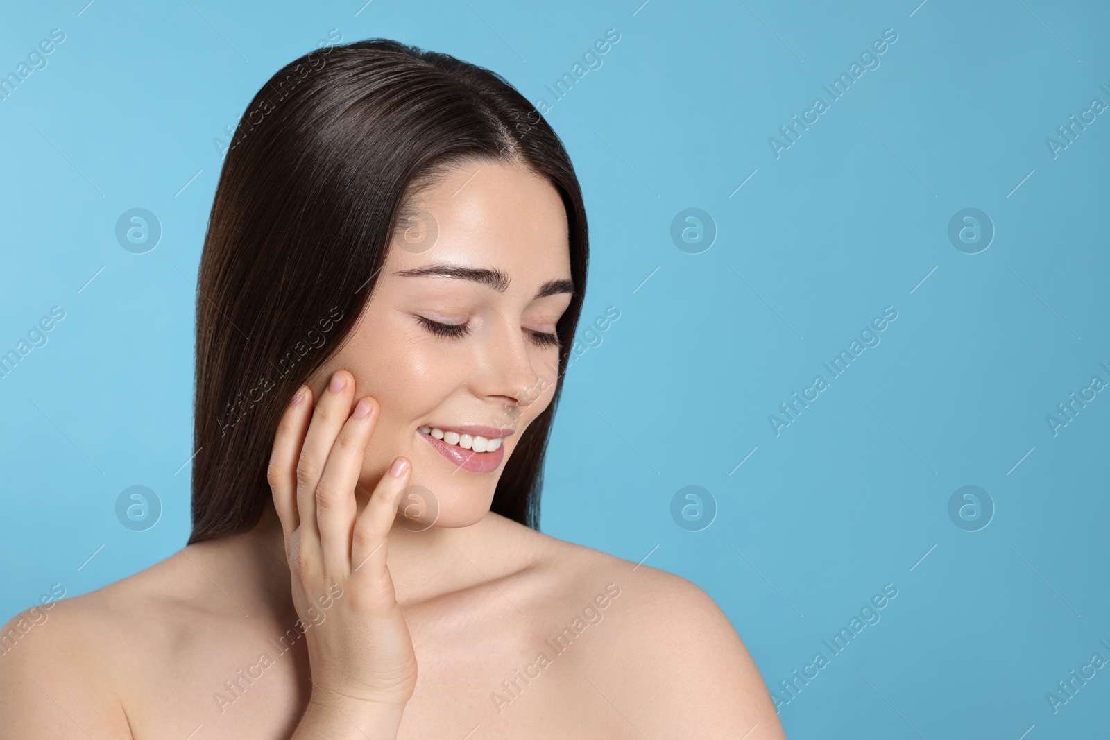 Photo of Portrait of attractive young woman on light blue background, space for text. Spa treatment