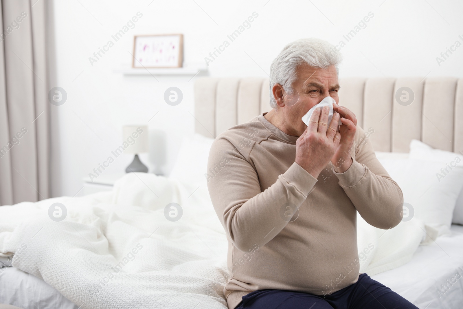 Photo of Sick mature man at home, space for text. Dangerous virus