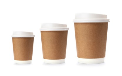 Set with different takeaway coffee cups on white background