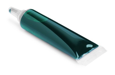 Tube with green food coloring on white background