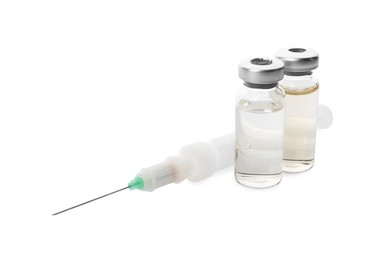 Photo of Disposable syringe with needle and vials isolated on white