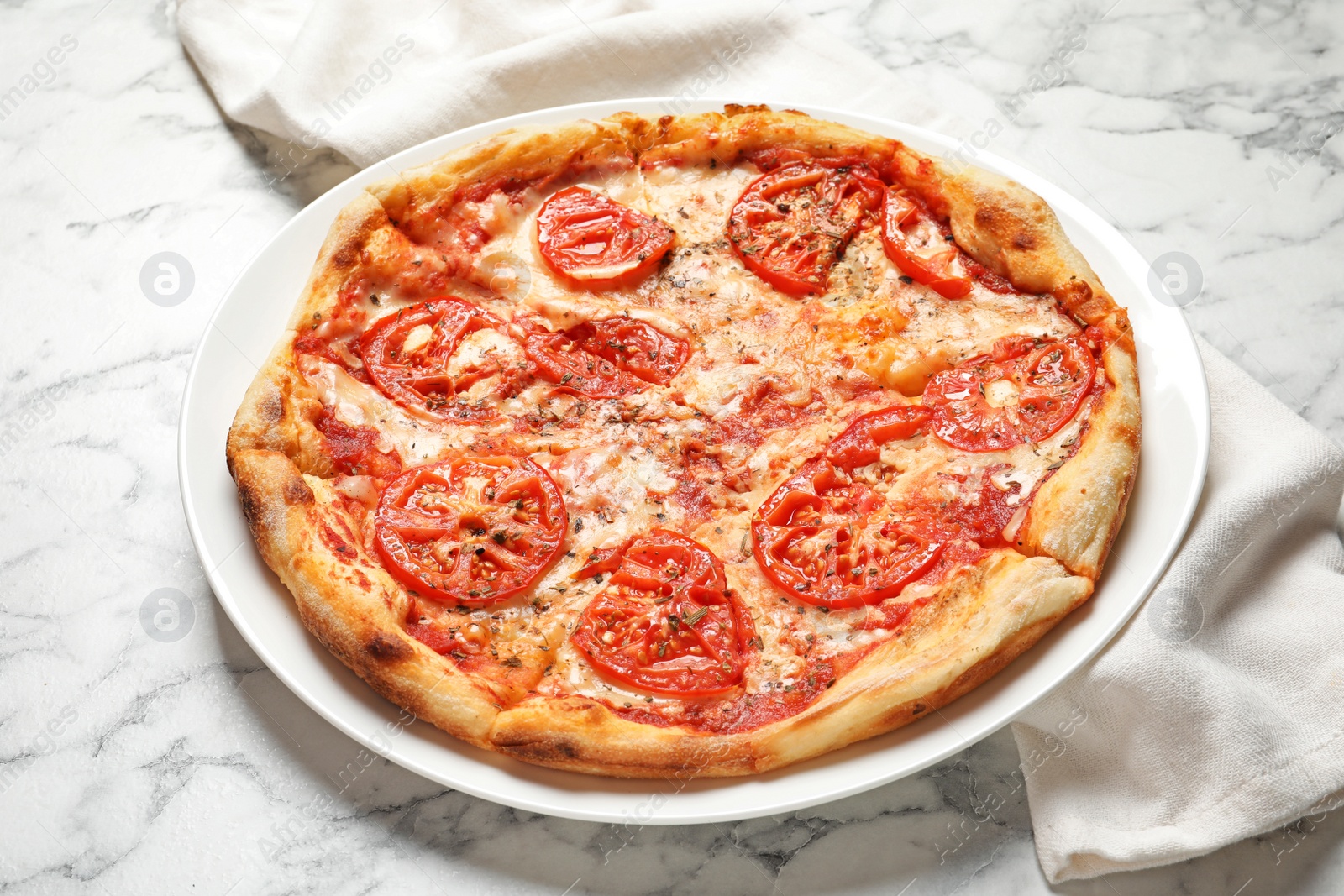 Photo of Hot cheese pizza Margherita on marble table