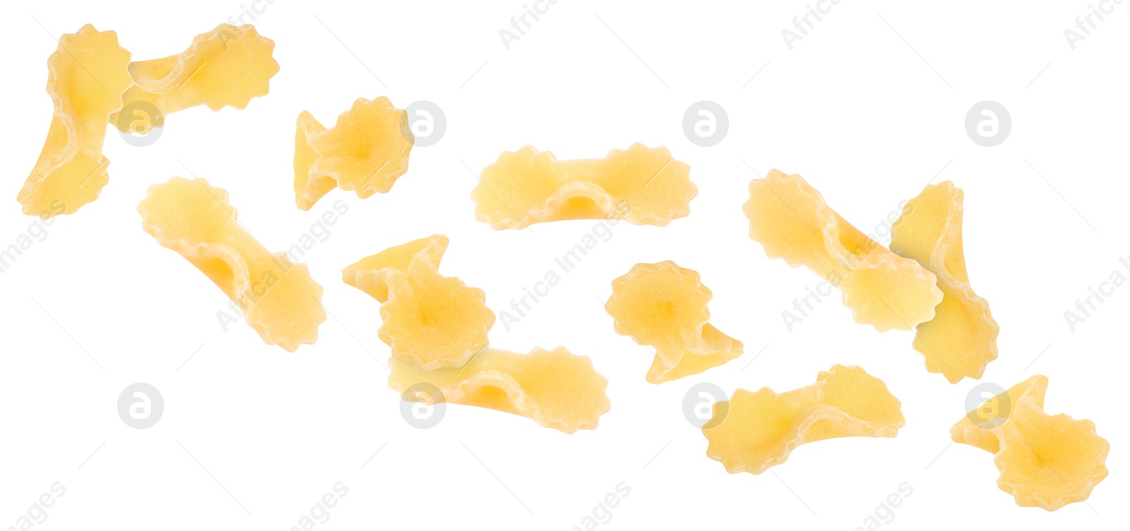 Image of Raw farfalline pasta falling on white background