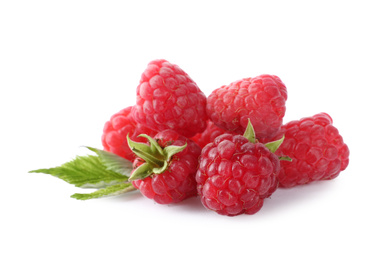 Photo of Pile of fresh ripe raspberries with leaves isolated on white