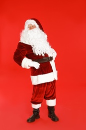 Photo of Happy authentic Santa Claus on red background